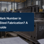 Structural steel member marked B42 during fabrication in a steel workshop